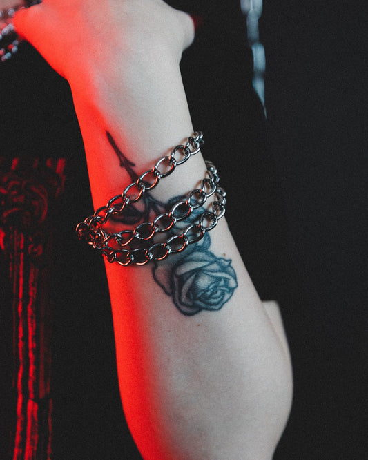Model wearing the Evil Things silver three tier chain bracelet