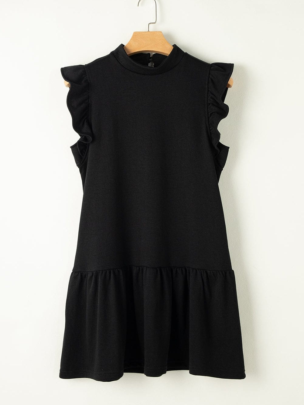 Ruffled cap sleeve detail on the black mini shift dress