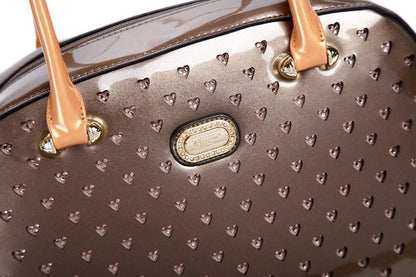 Starz Art retro crystal-studded vegan leather overnight bag with a latch closure and detachable strap, from Pinup Girl Clothing