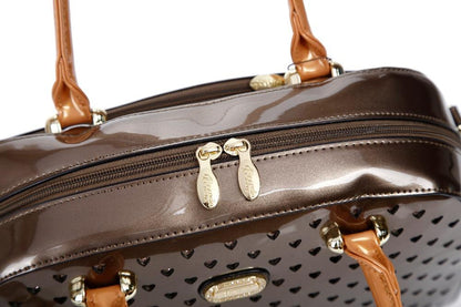Starz Art retro crystal-studded vegan leather overnight bag with a latch closure and detachable strap, from Pinup Girl Clothing