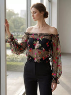 Floral embroidered mesh off-shoulder top in black by Pinup Girl Clothing.