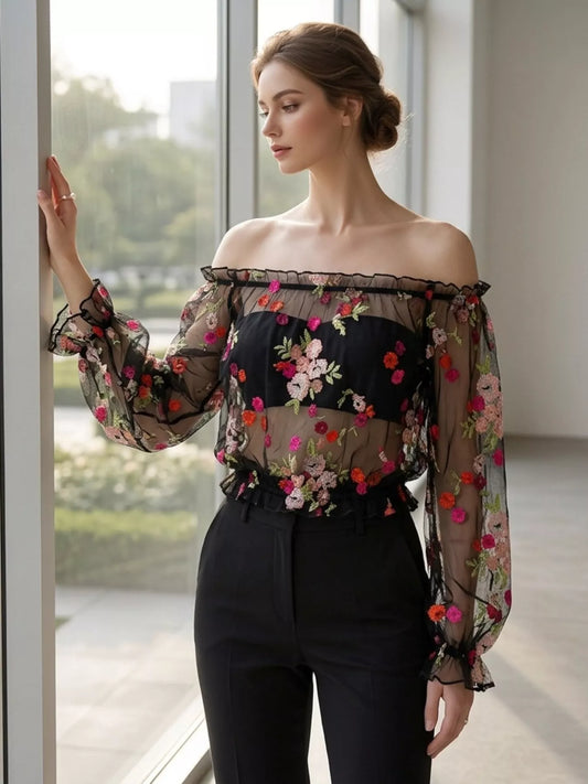 Floral embroidered mesh off-shoulder top in black by Pinup Girl Clothing.