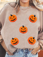 Drop shoulder seam detail on the taupe brown Great Pumpkin sweatshirt