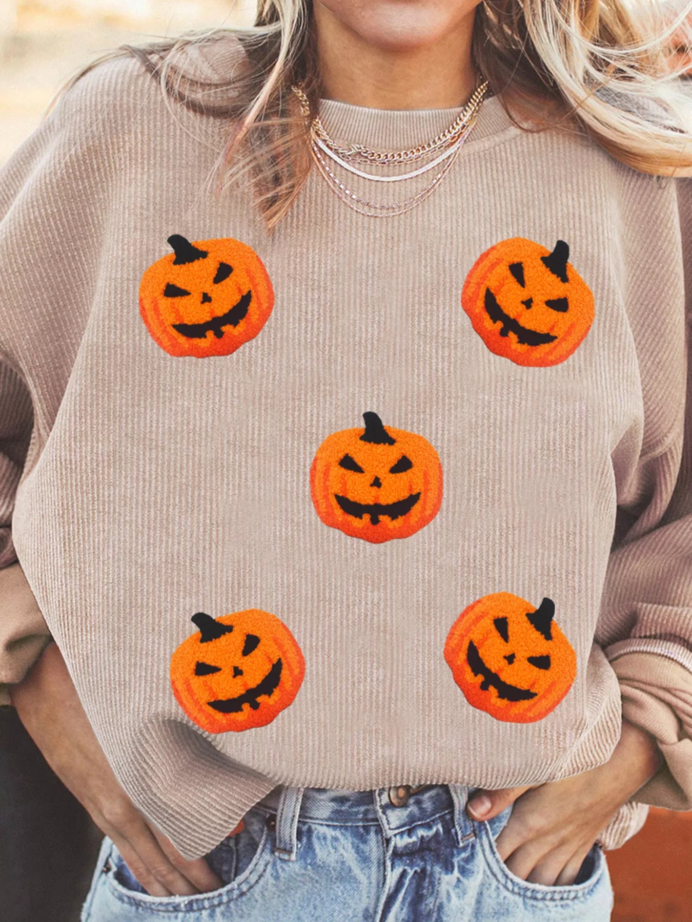 Drop shoulder seam detail on the taupe brown Great Pumpkin sweatshirt