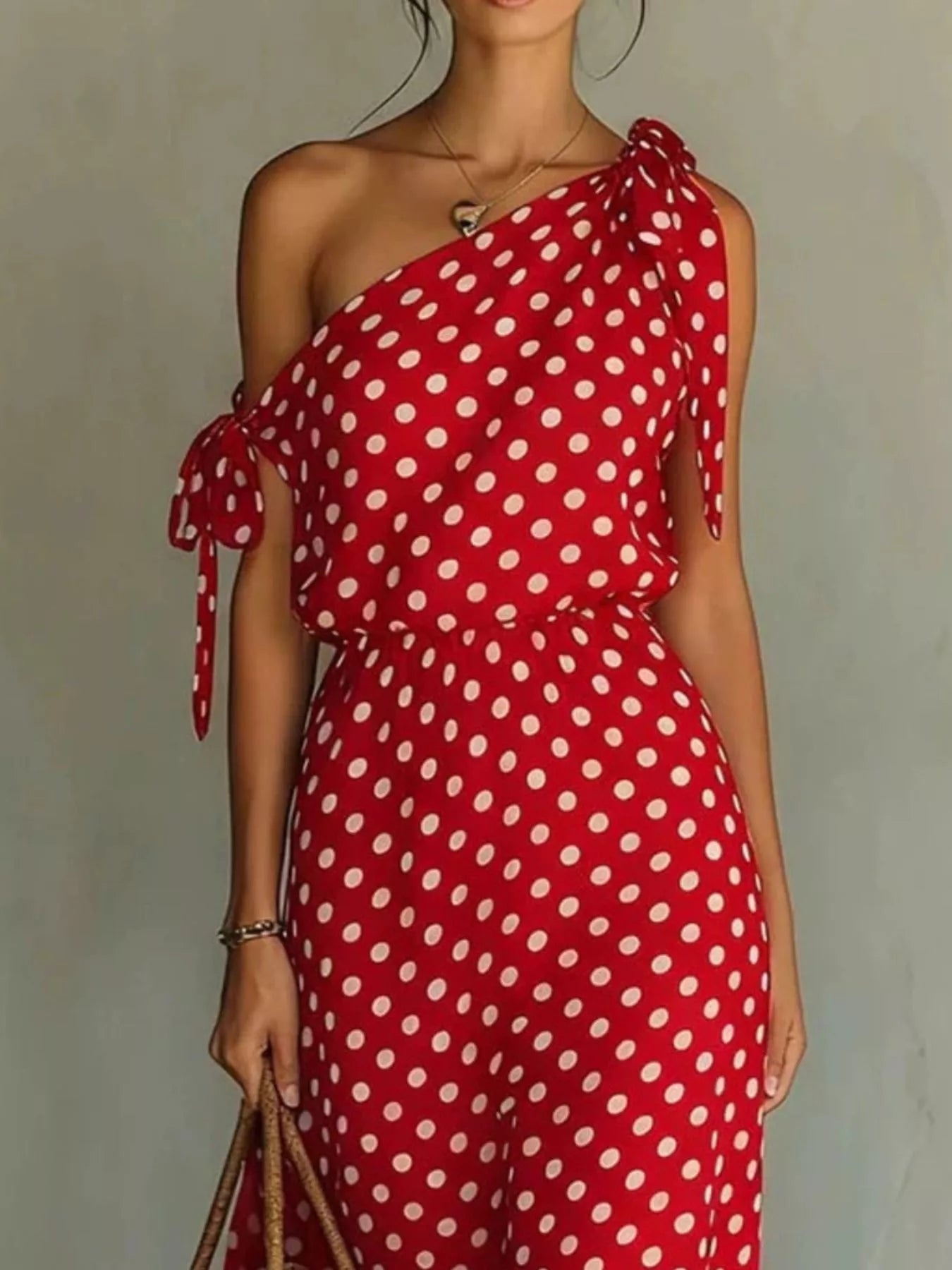 Skirt and elastic waist detail on the Dorothea one-shoulder polka dot midi dress, by Pinup Girl Clothing