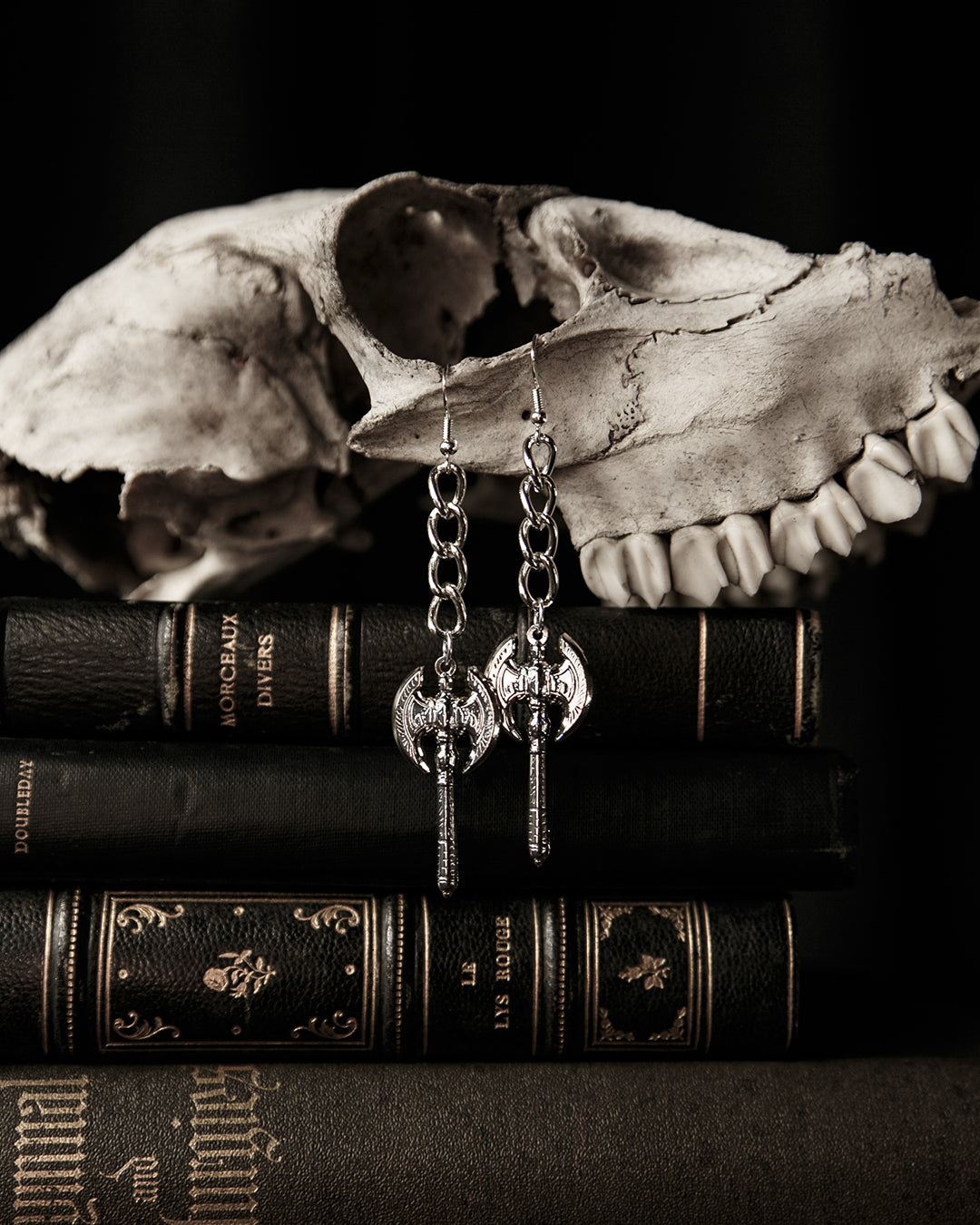 Close-up of the silver battle axe charm on the Beserker earrings, The Pretty Cult