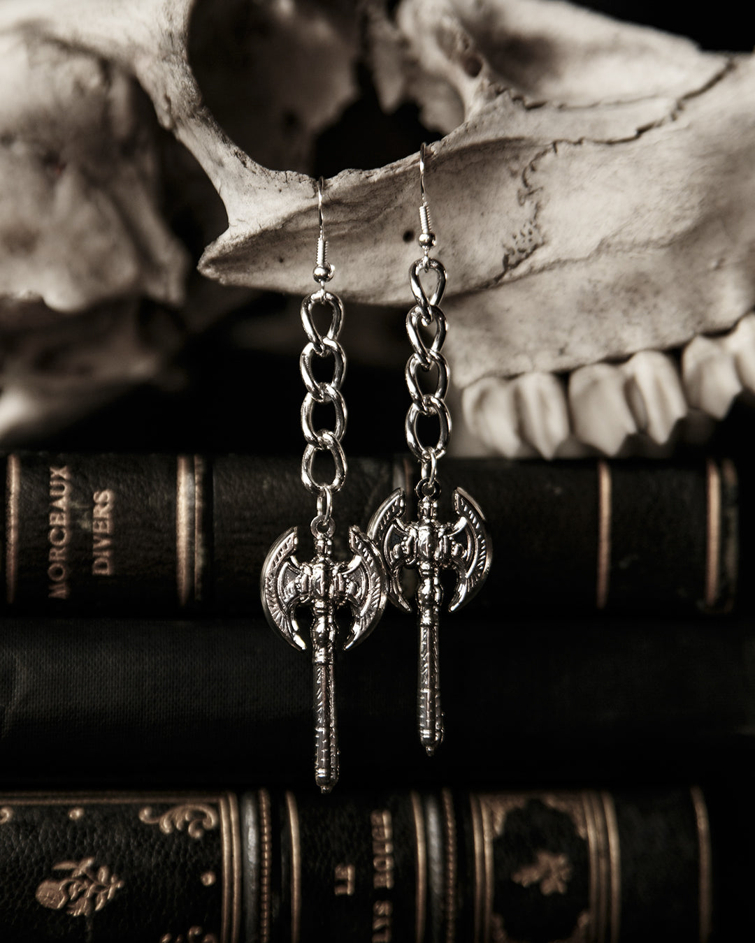 Silver battle axe drop earrings on curb chain, by The Pretty Cult