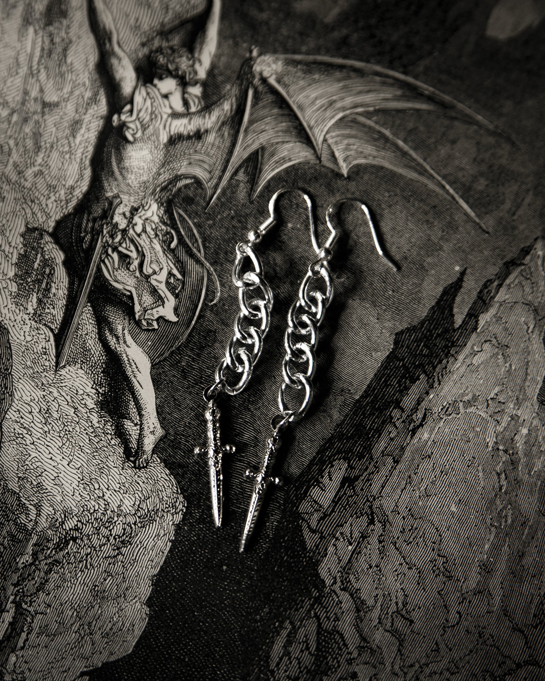 Close-up of the silver dagger charm on the Athame earrings, The Pretty Cult