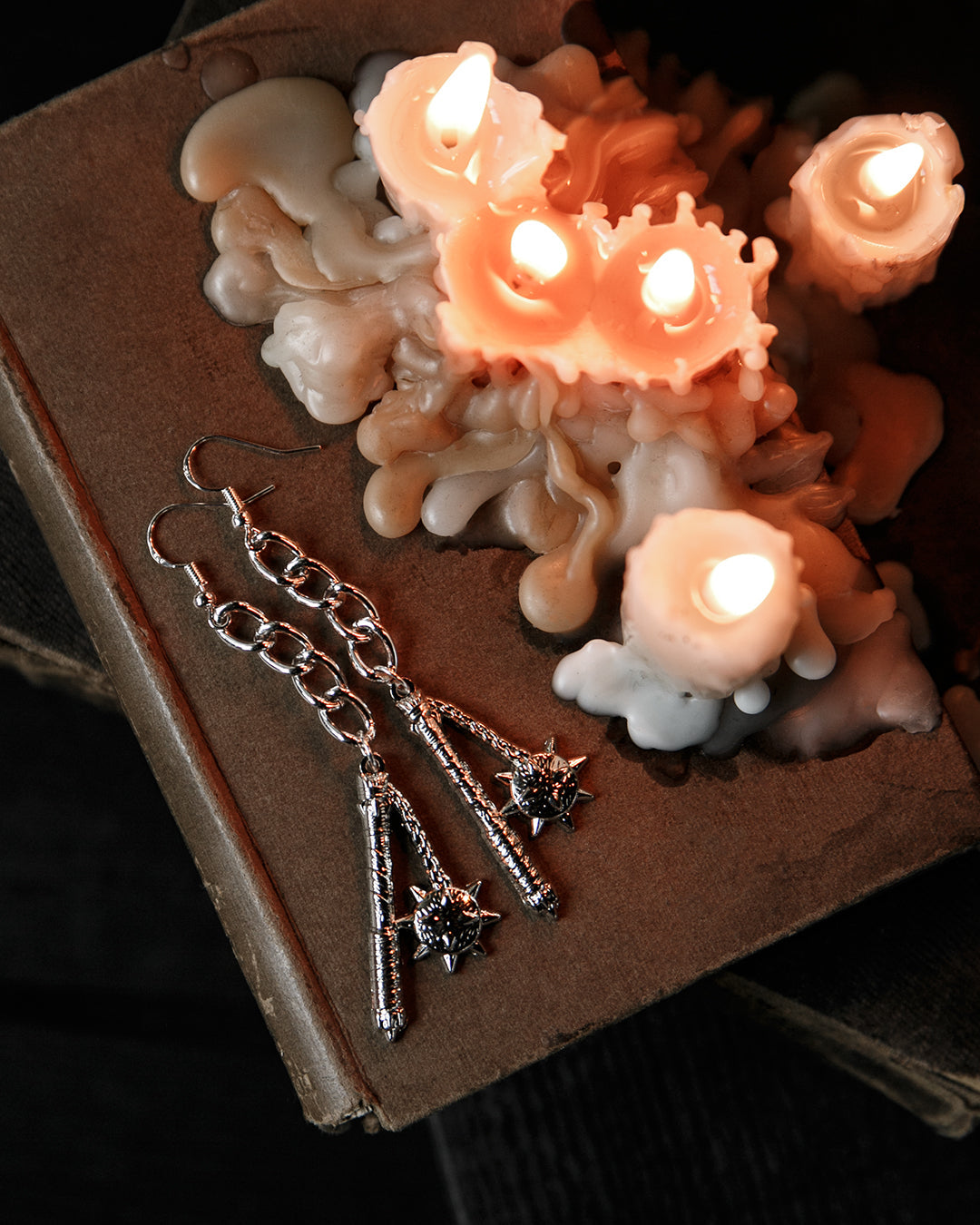 Close-up of the silver spiked flail charm, The Pretty Cult