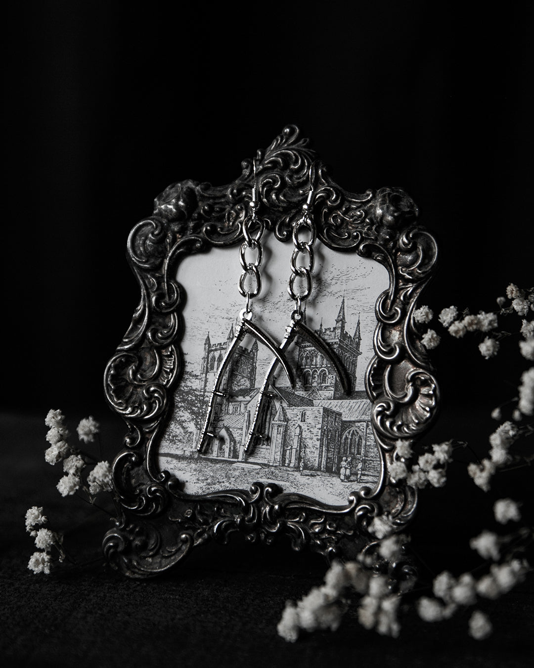 Silver scythe drop earrings shown as a pair, The Pretty Cult