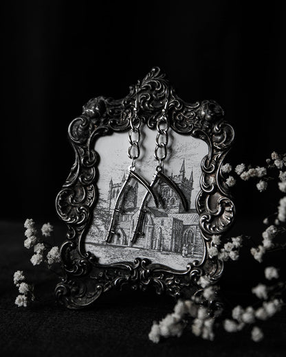 Silver scythe drop earrings shown as a pair, The Pretty Cult