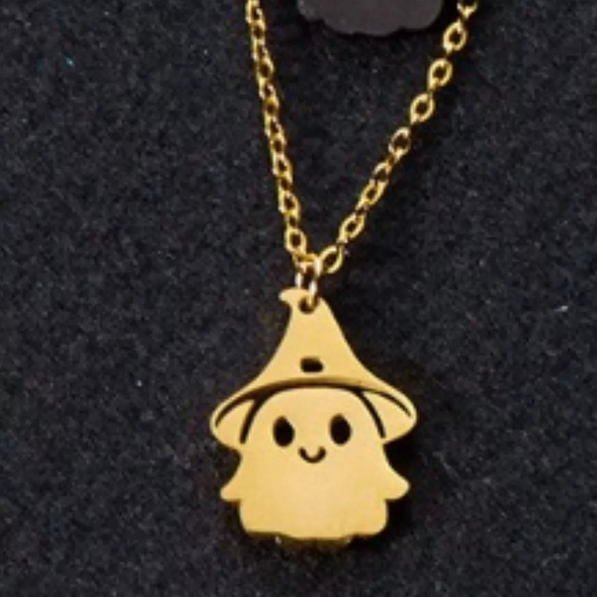 Scale view of the gold ghost pendant necklace
