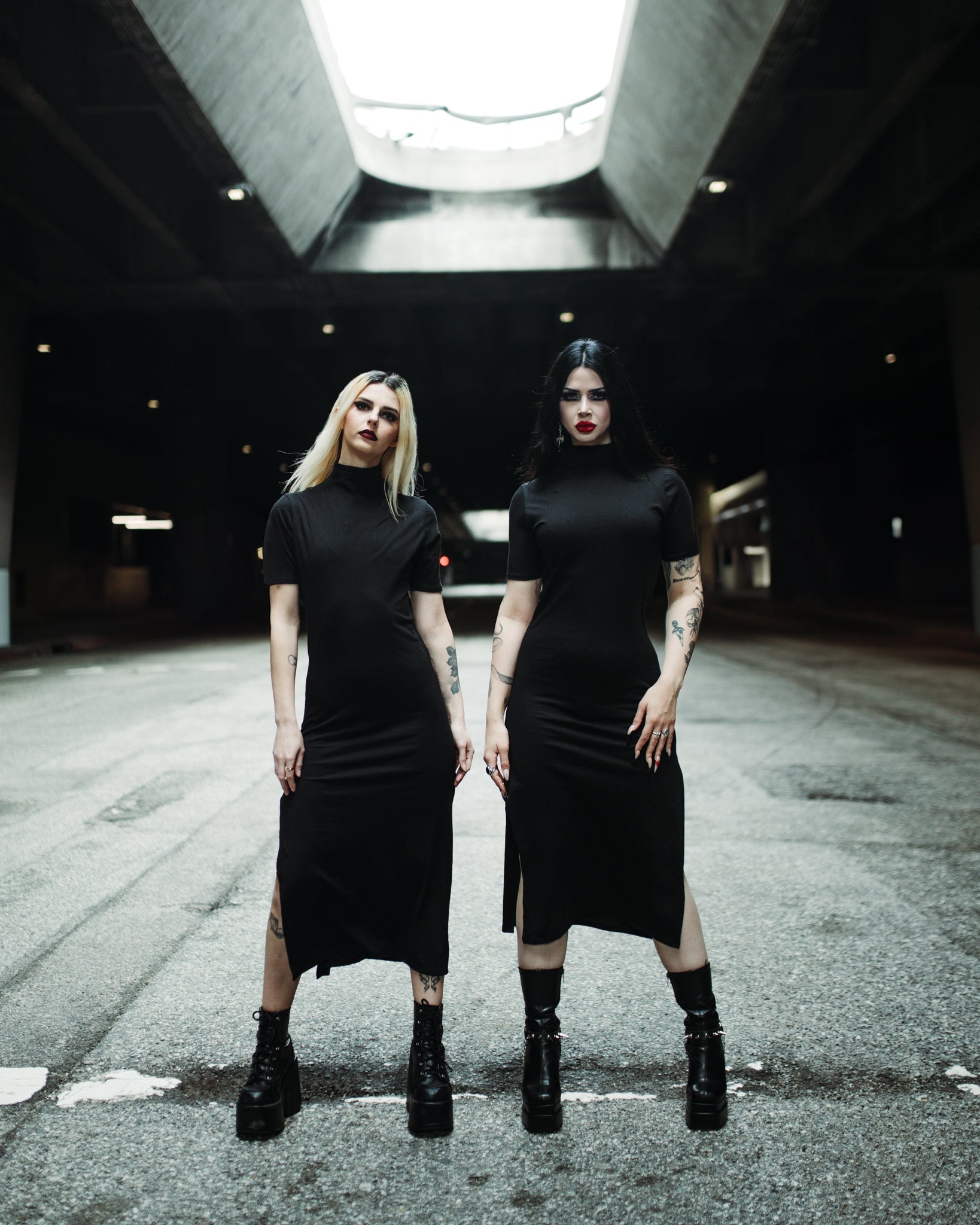 Black midi dress with a mid neckline and side slits by The Pretty Cult