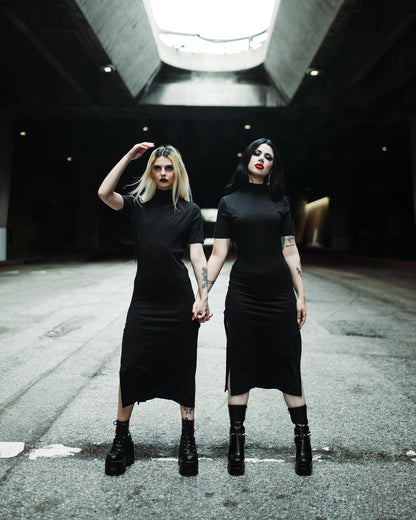 Side slit on the black Seer midi dress