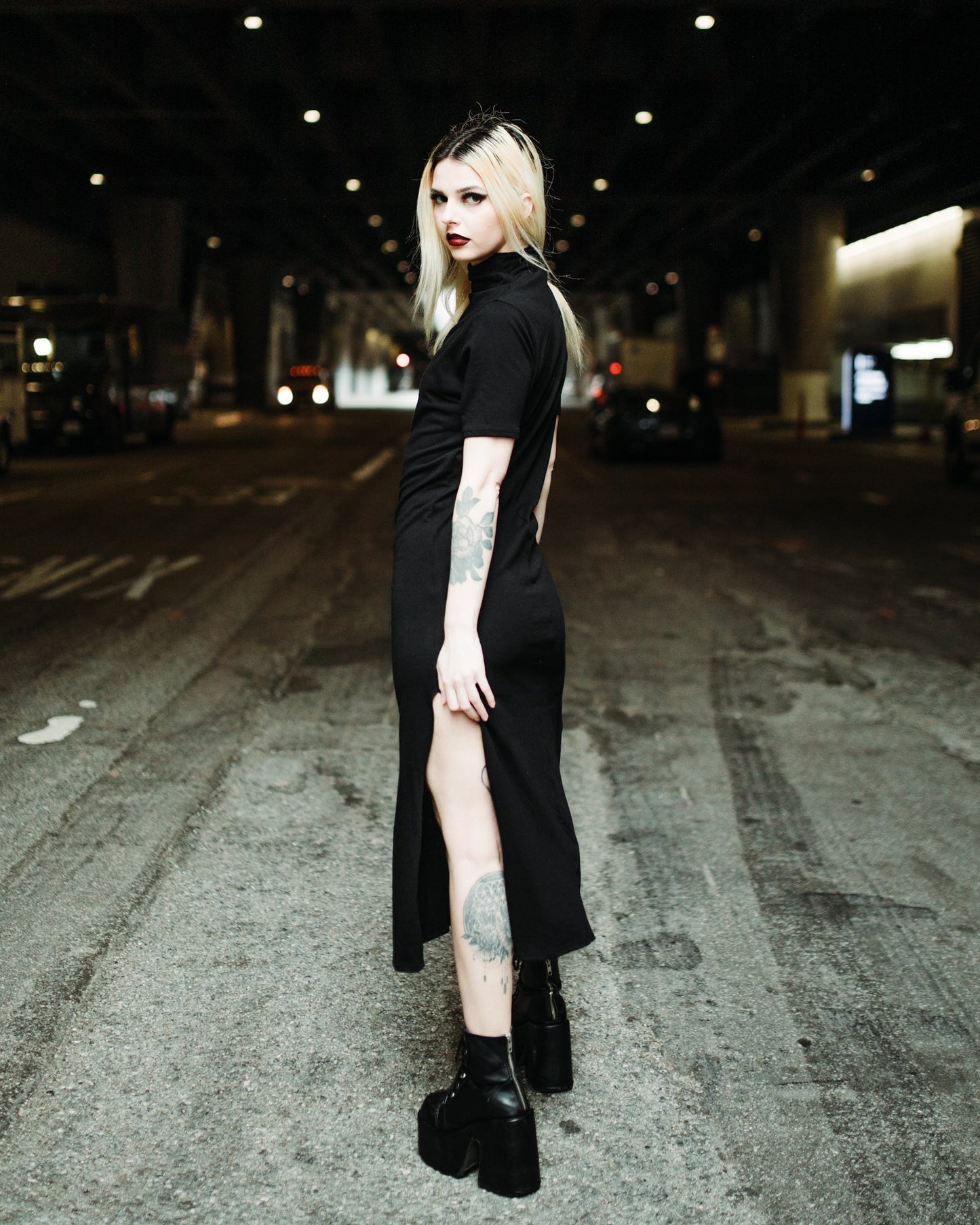 Black Seer midi dress styled with a harness