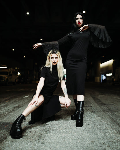 Full length view of the black Seer midi dress