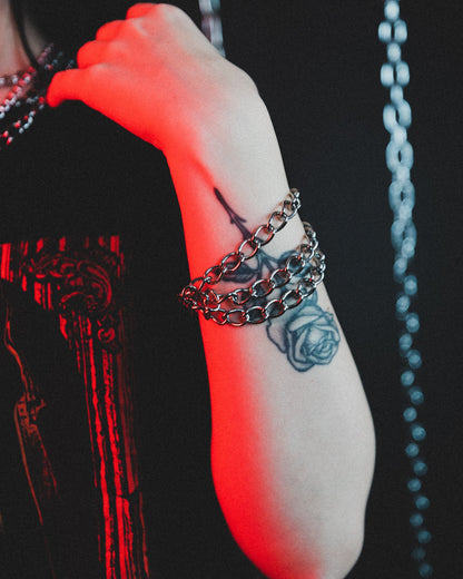 Evil Things silver tiered bracelet styled with rings
