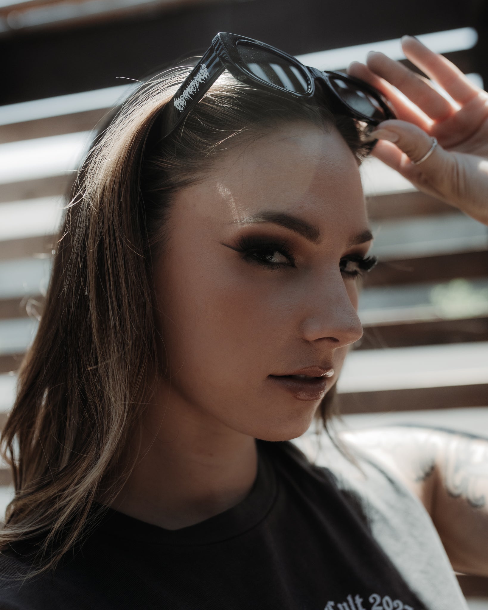 Side view of the slim black rectangular Black Metal sunglasses, The Pretty Cult
