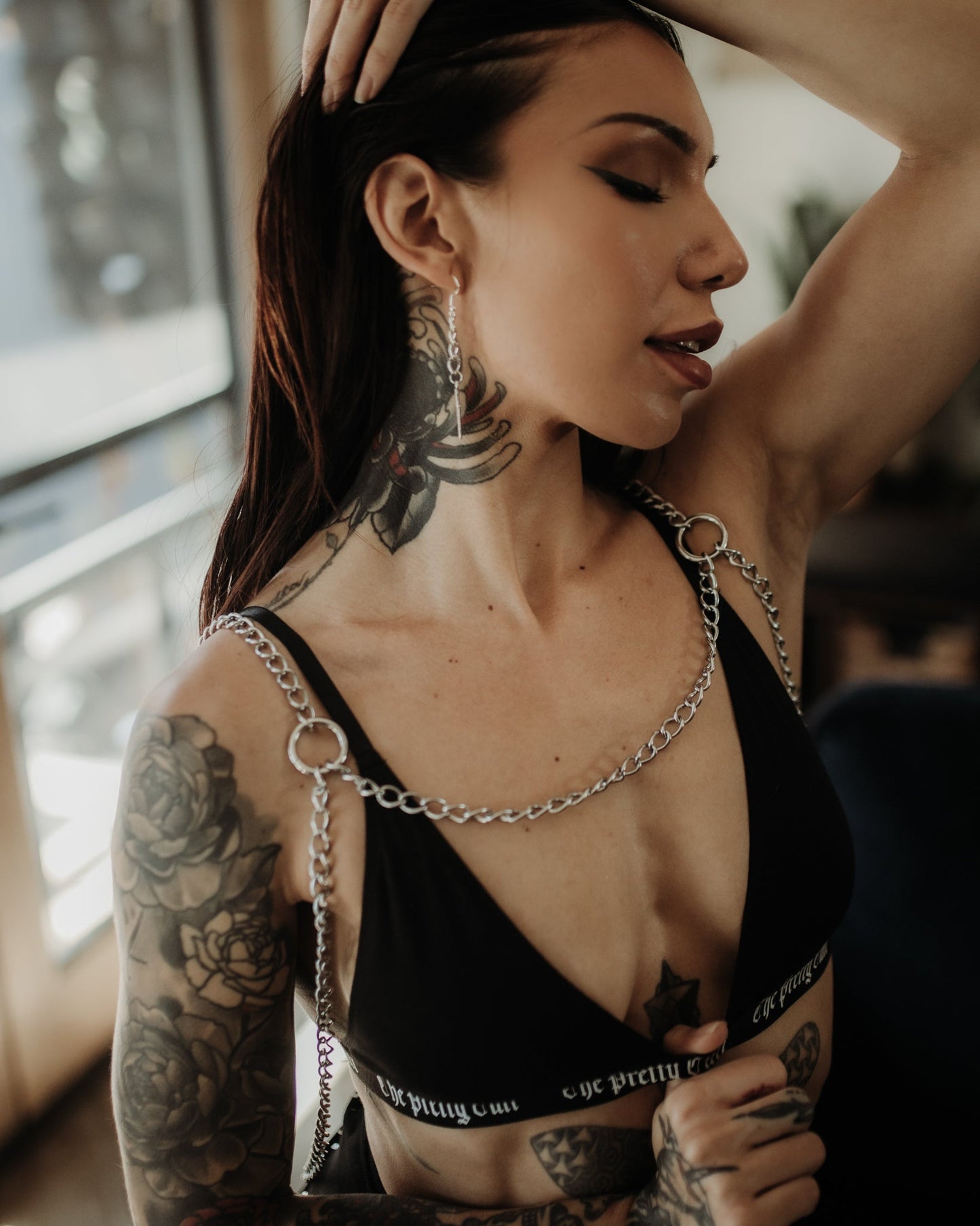 Model wearing the Sacrifiant silver chain body harness