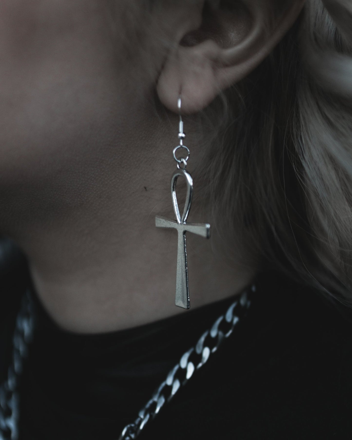 Model wearing the Ankh drop earring in silver on a sterling hook, by The Pretty Cult