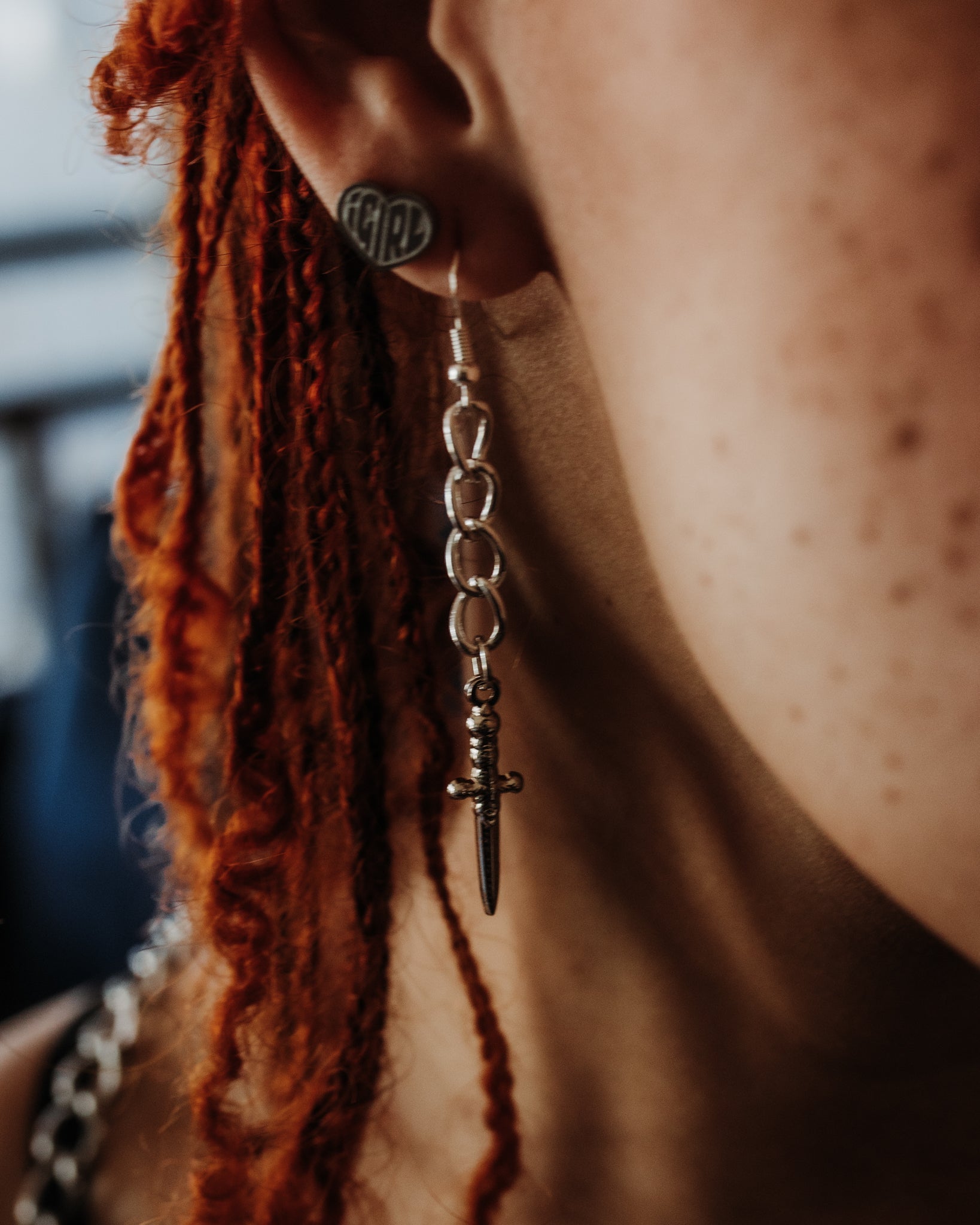 Athame silver dagger earrings styled against a dark background, The Pretty Cult