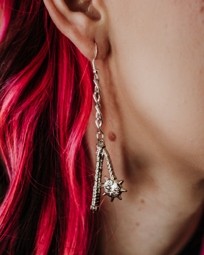 Model wearing the silver Flail drop earrings, The Pretty Cult