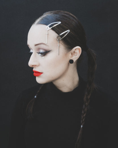 Sword silver hair clips pinned into a center part, The Pretty Cult