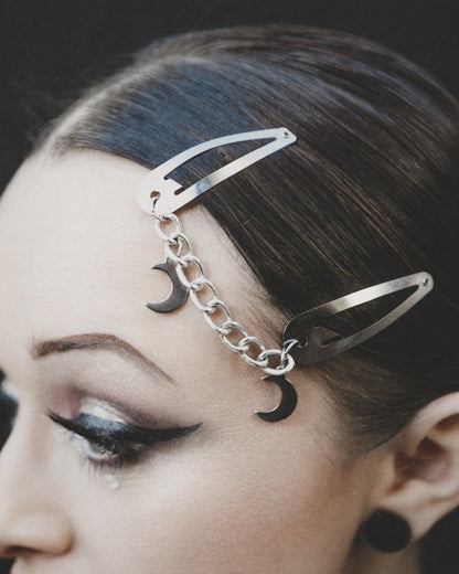 Model wearing the Double Moon silver hair clips with chain and crescent moon charms, by The Pretty Cult
