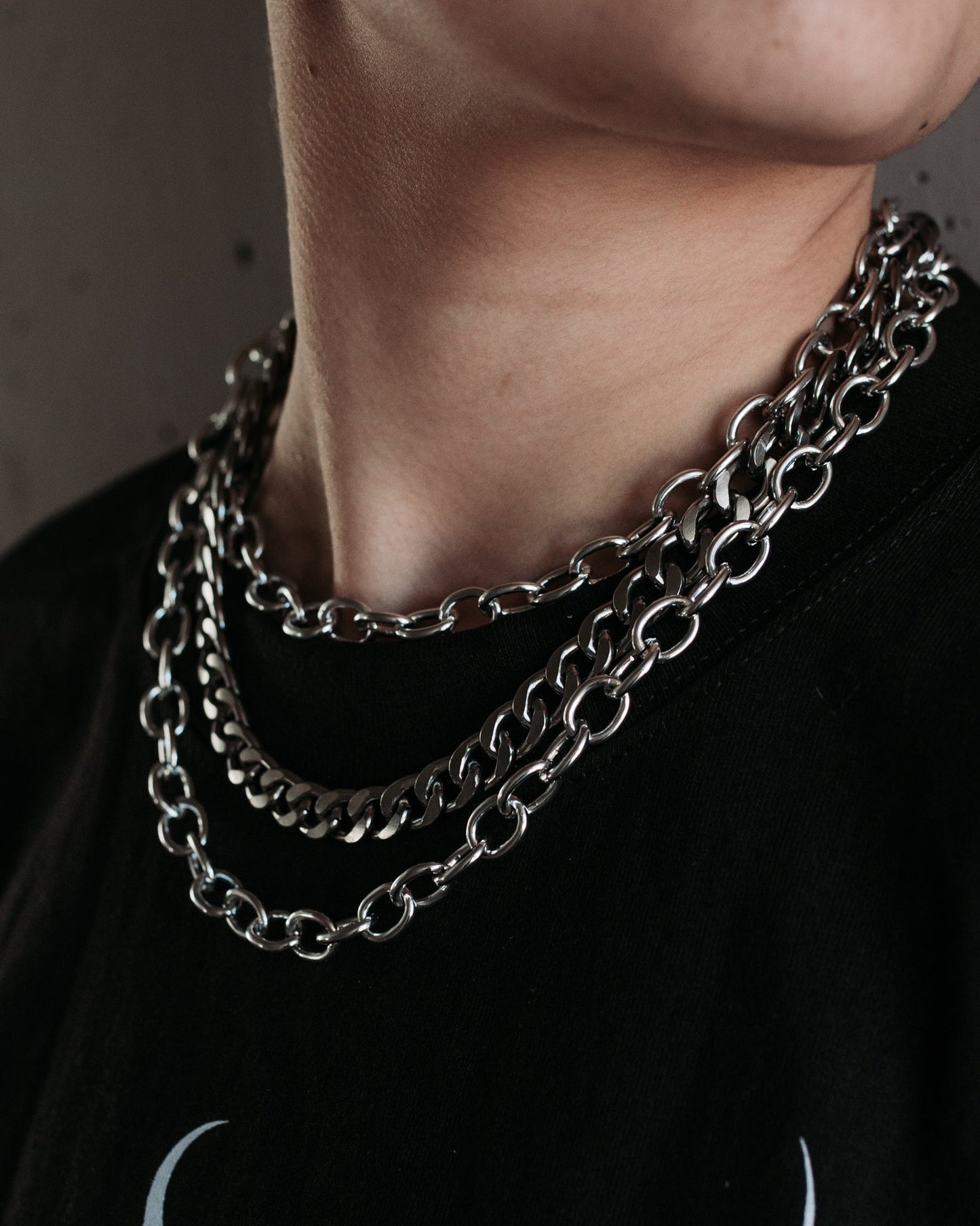 Close up of the Covet silver three tier chain necklace