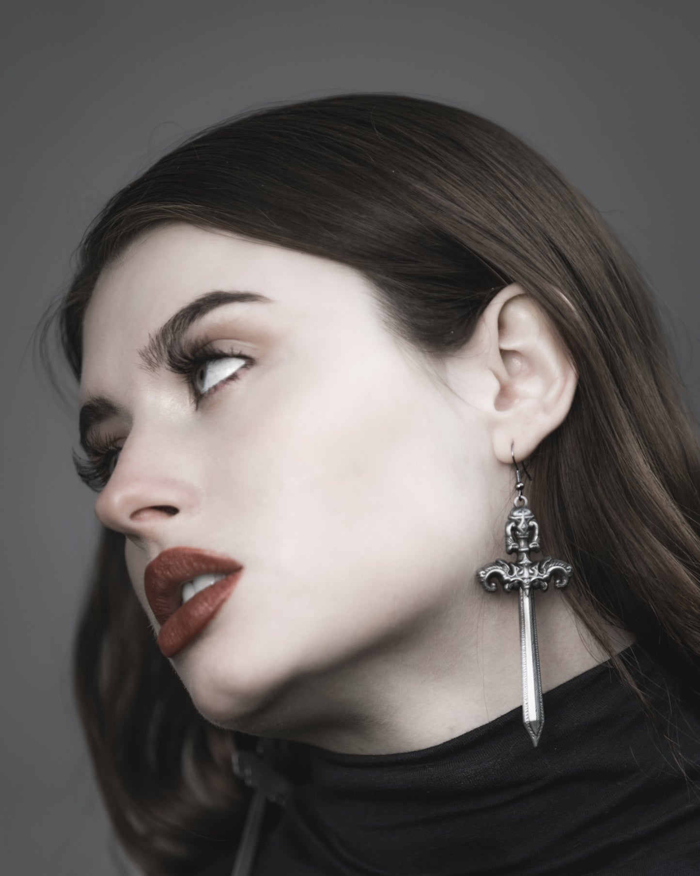 Close-up of the antiqued silver sword charm on the Woe Blade earrings, The Pretty Cult