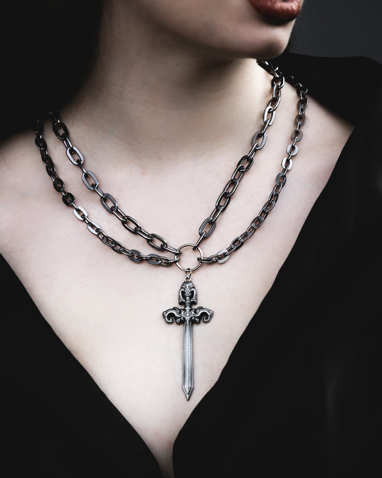 Model wearing the Woe Blade silver sword double chain necklace