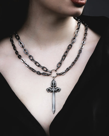 Model wearing the Woe Blade silver sword double chain necklace