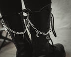 Close up of the Winter Moon silver crescent charms on the boot chain