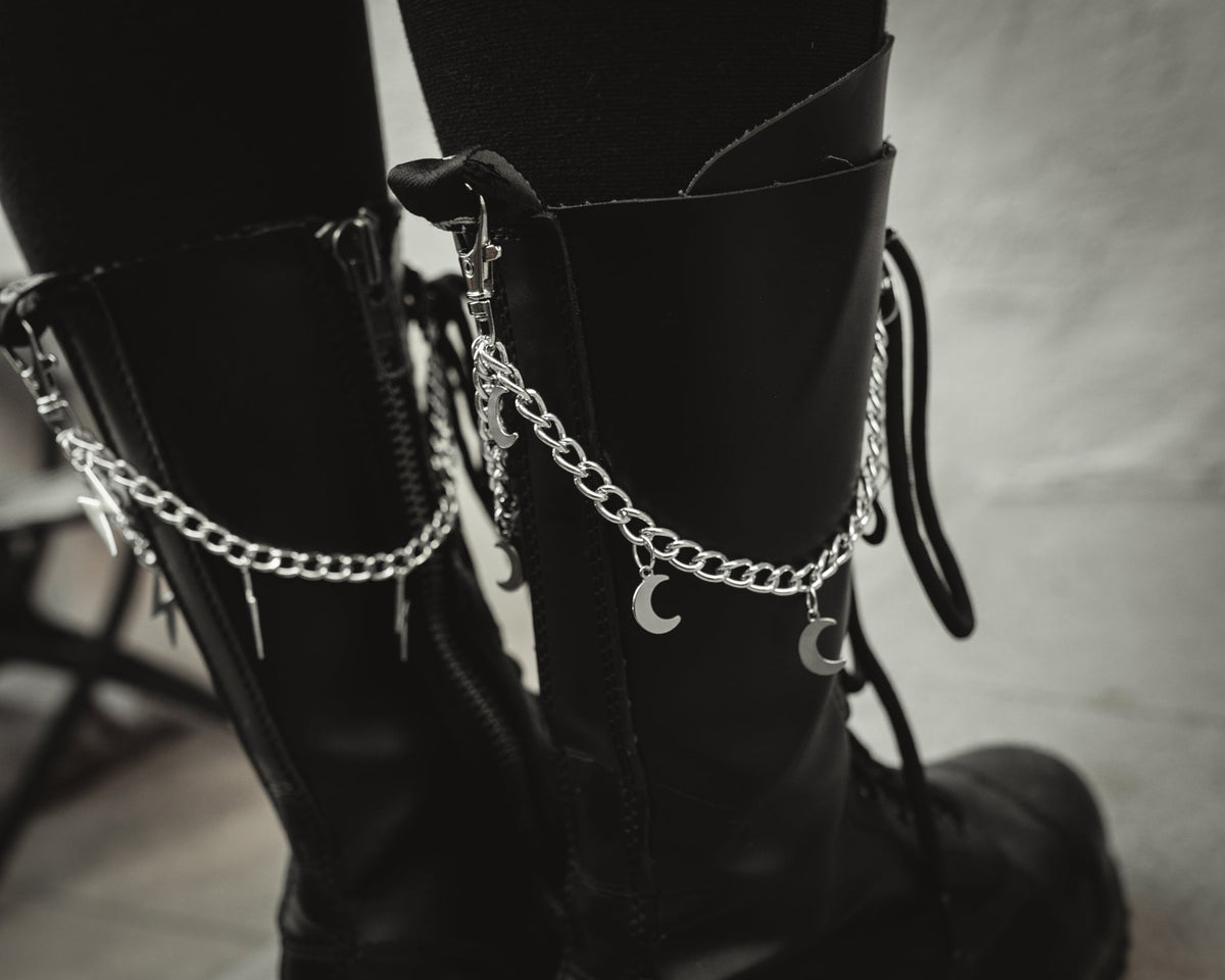 Close up of the Winter Moon silver crescent charms on the boot chain