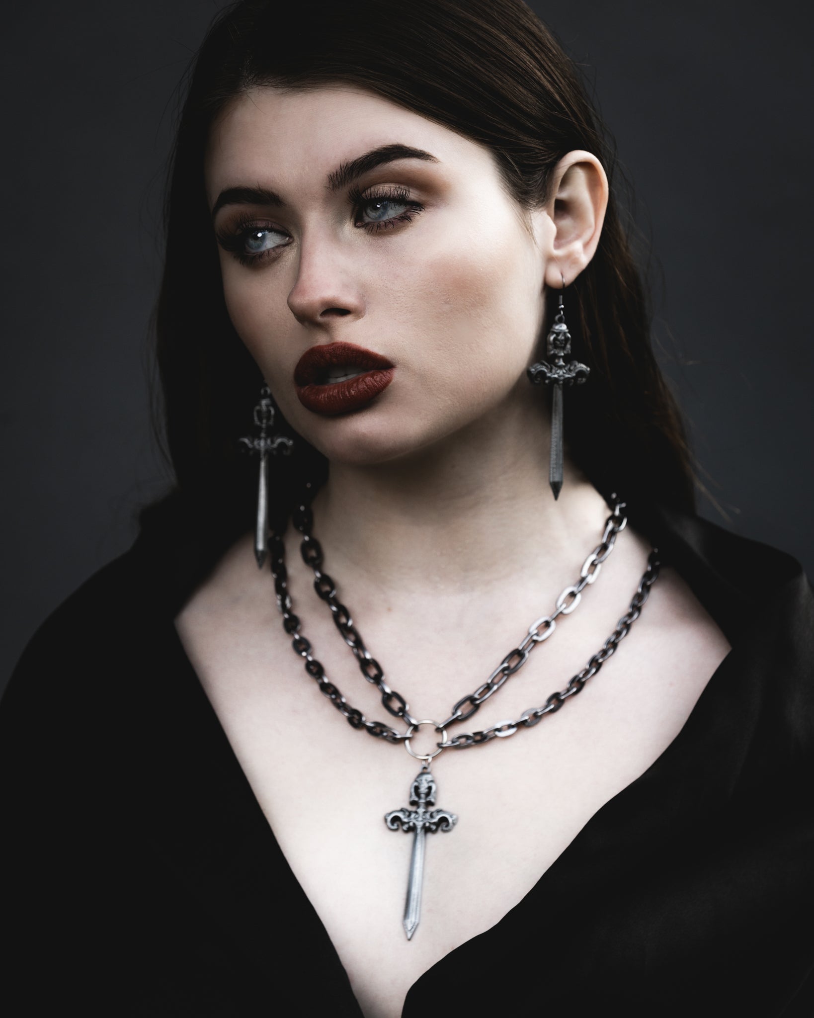 Close up of the Woe Blade silver sword pendant