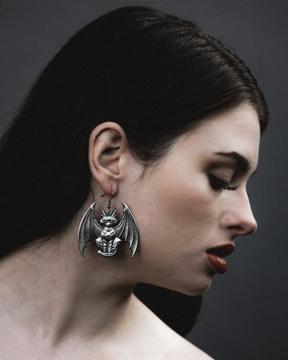 Model wearing the Lethal antiqued silver winged gargoyle cat earring, by The Pretty Cult