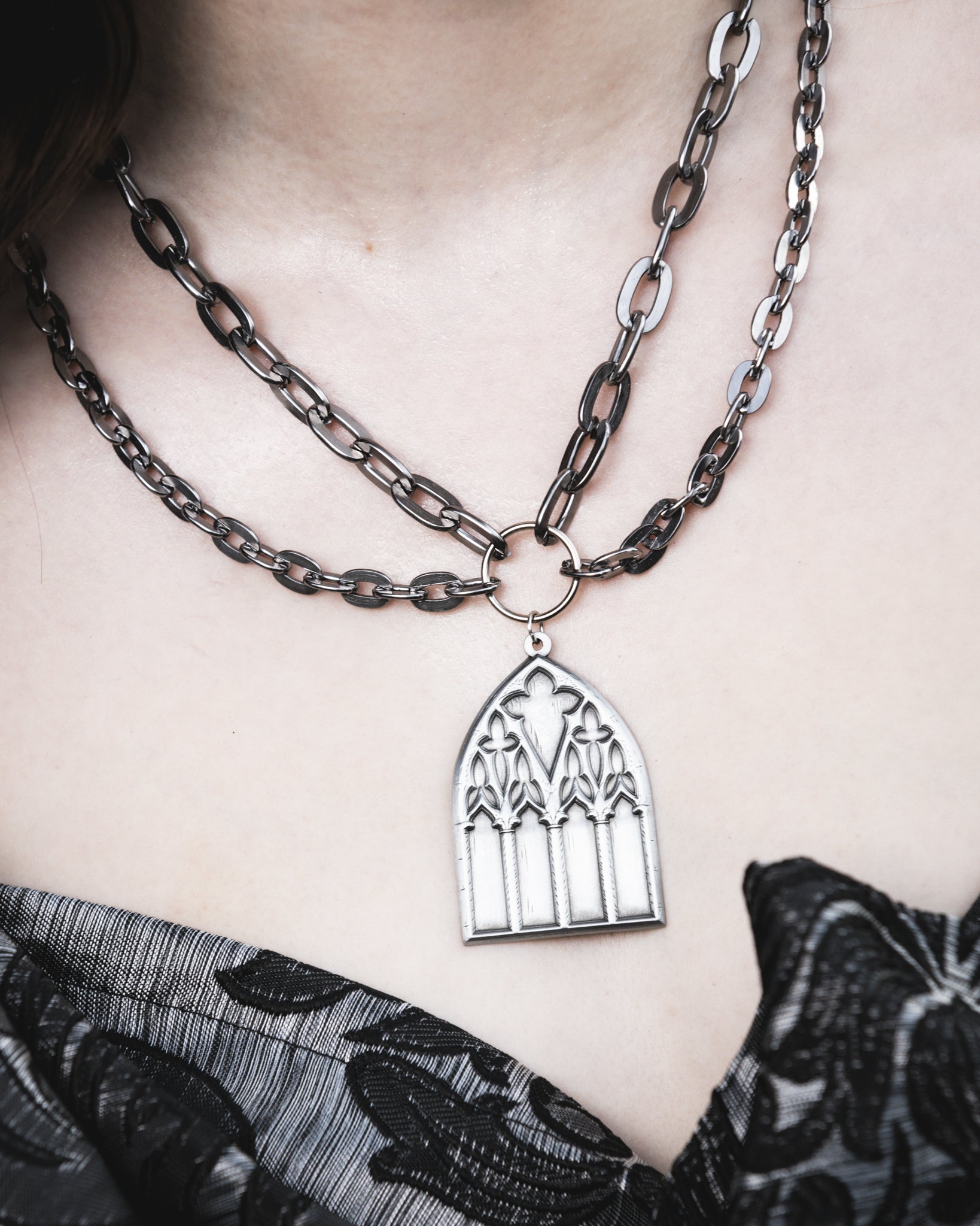 Dark Sacrament silver layered chain necklace styled on model