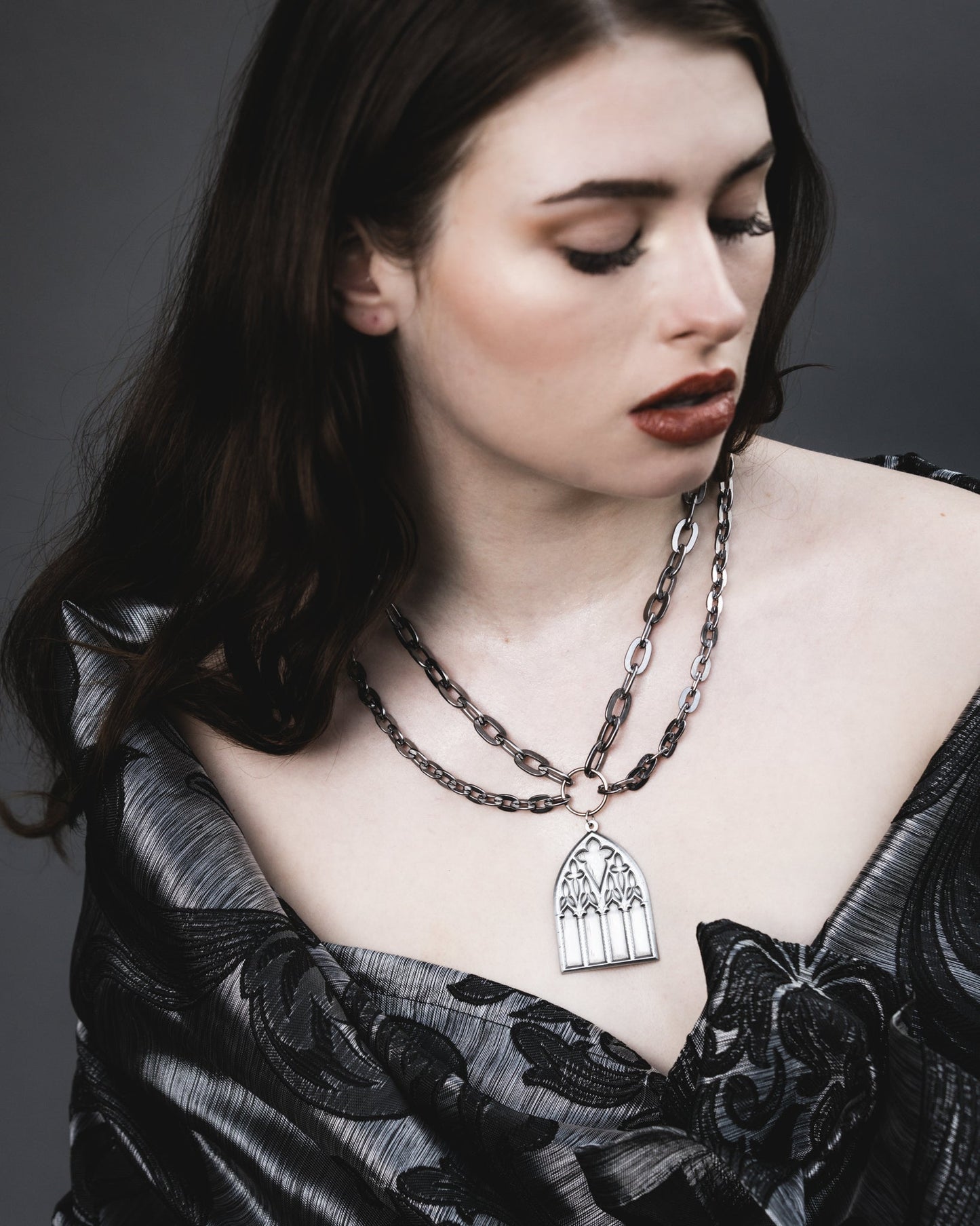 Side view of the Dark Sacrament silver pendant necklace