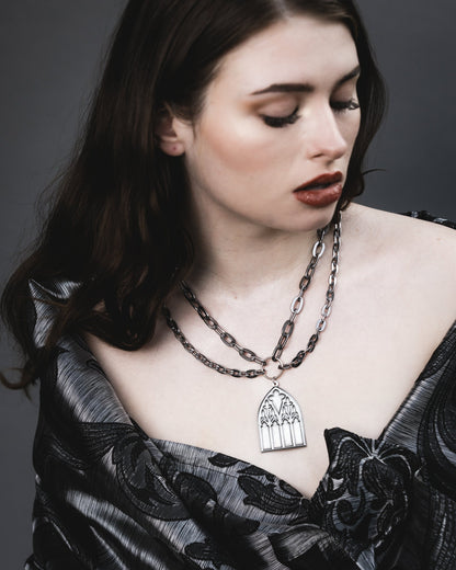 Side view of the Dark Sacrament silver pendant necklace