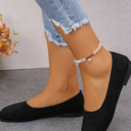 Audrey round toe ballet flats in black, side view