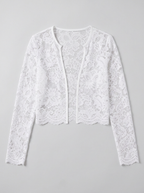 White sheer floral lace open front long sleeve jacket, flat lay on a soft grey background showing the scalloped hem and cuffs