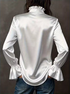 Vintage flounce-sleeve blouse in a romantic silhouette, by Pinup Girl Clothing, sizes XS to 4X.