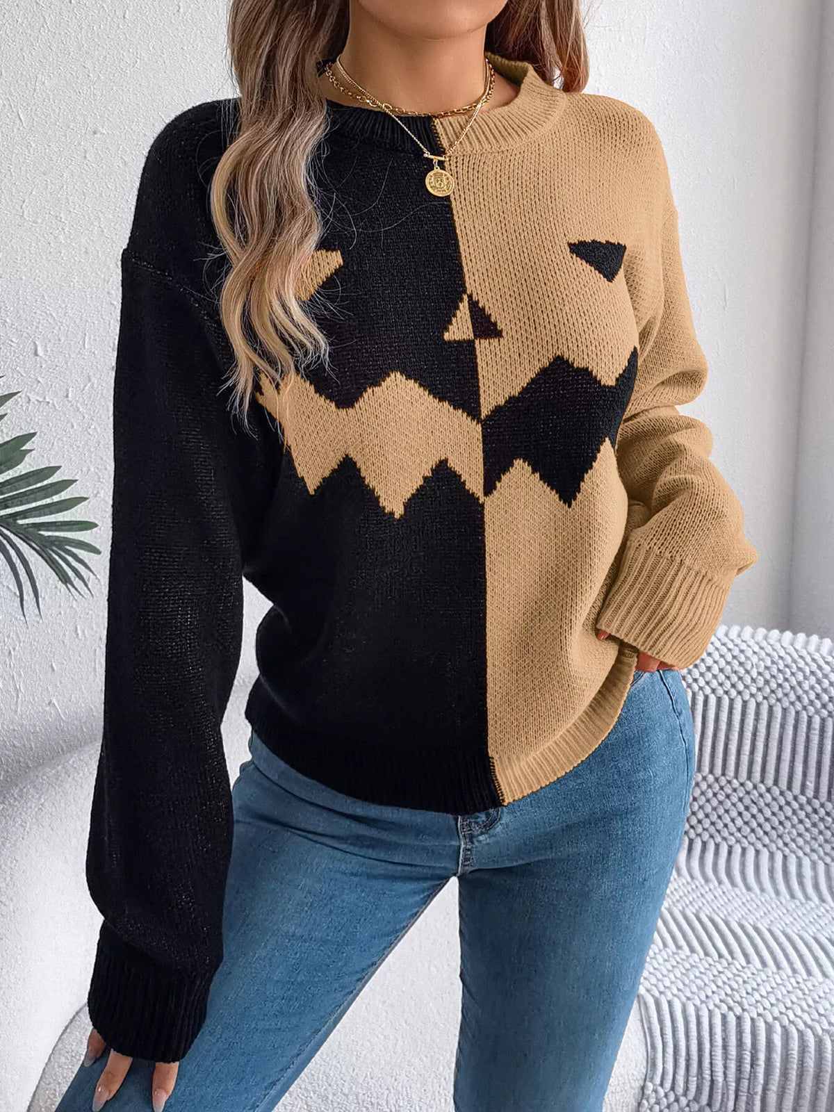Carved two-tone pumpkin face sweater in black and camel