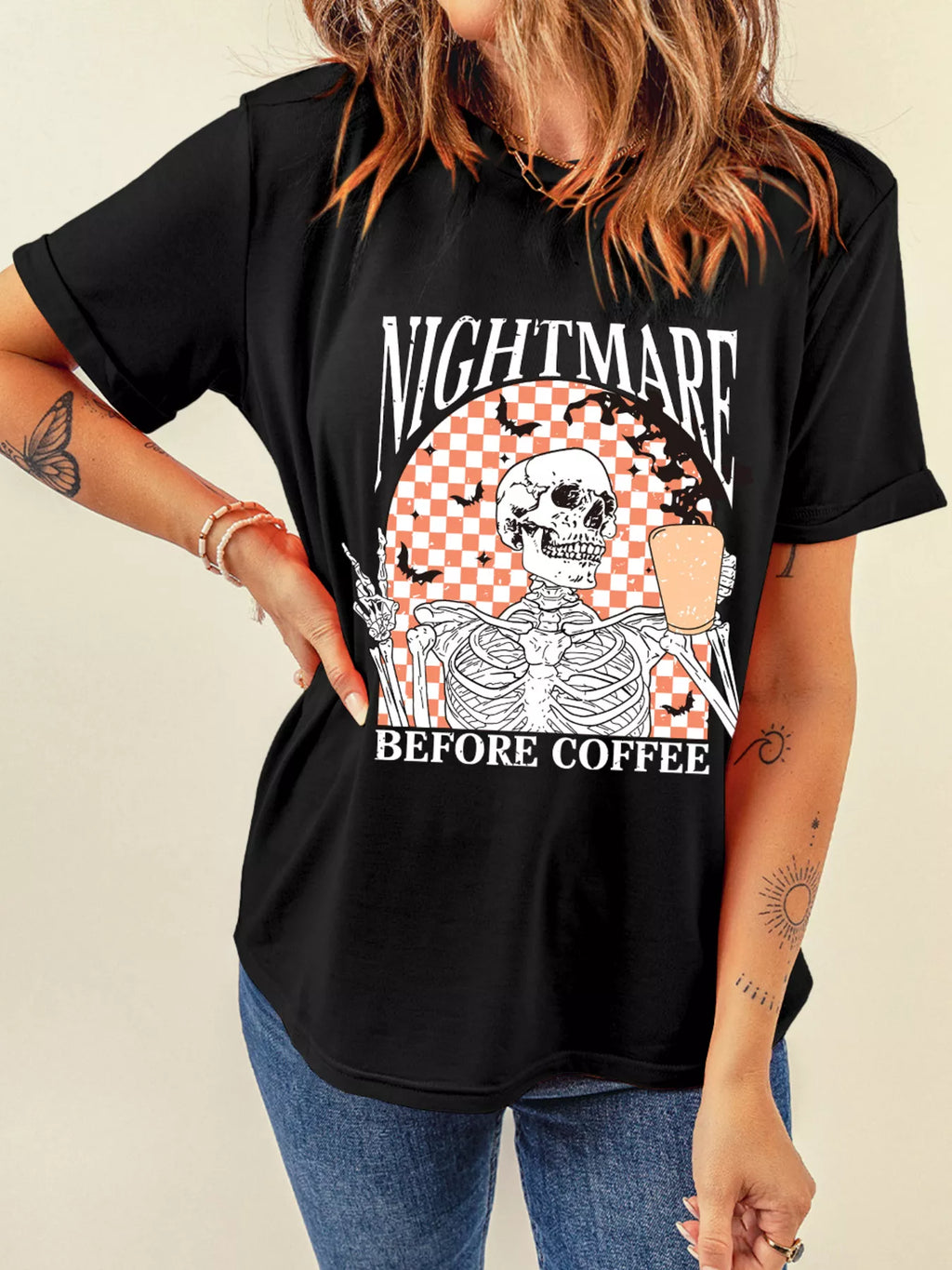 Skeleton and coffee cup checkerboard graphic on a black tee, front view