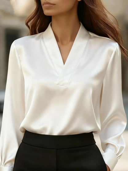 Vintage Noir V-neck satin blouse in white by Pinup Girl Clothing.