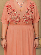 Close up of the red and cream floral embroidery on the Frolic coral maxi dress bodice