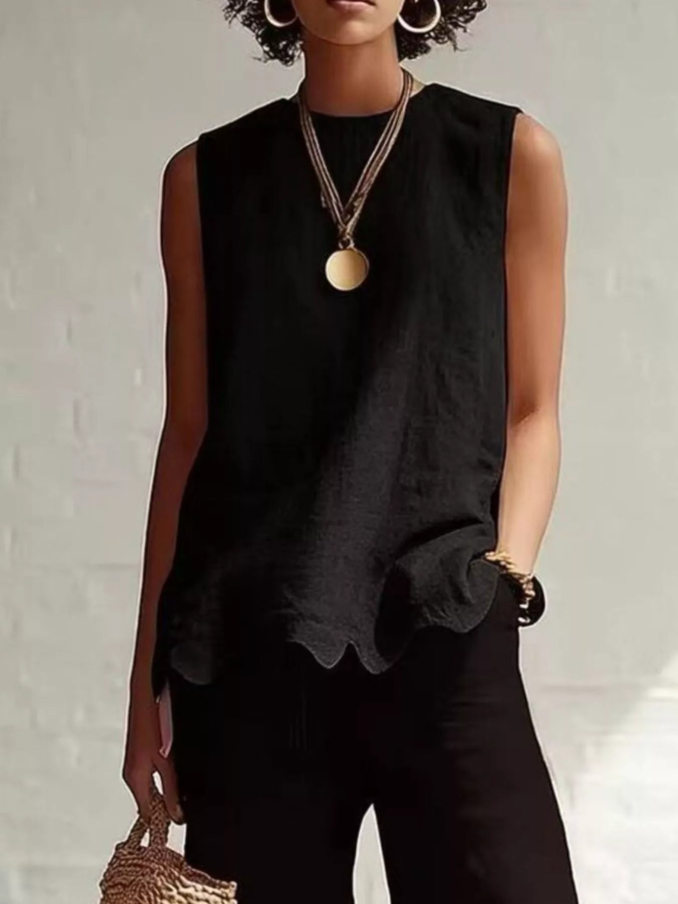 Odile scalloped hem sleeveless blouse in black by Pinup Girl Clothing