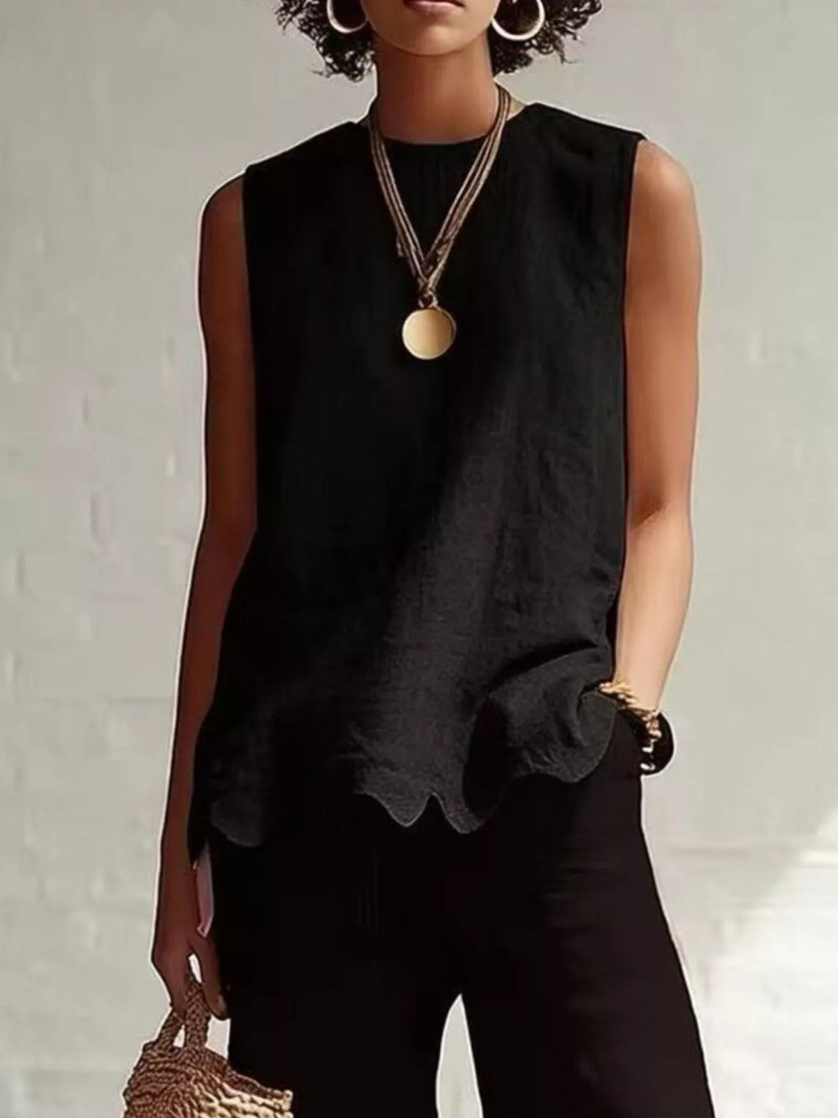 Odile scalloped hem sleeveless blouse in black by Pinup Girl Clothing