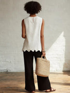 Odile scalloped hem sleeveless blouse shown from the back, by Pinup Girl Clothing