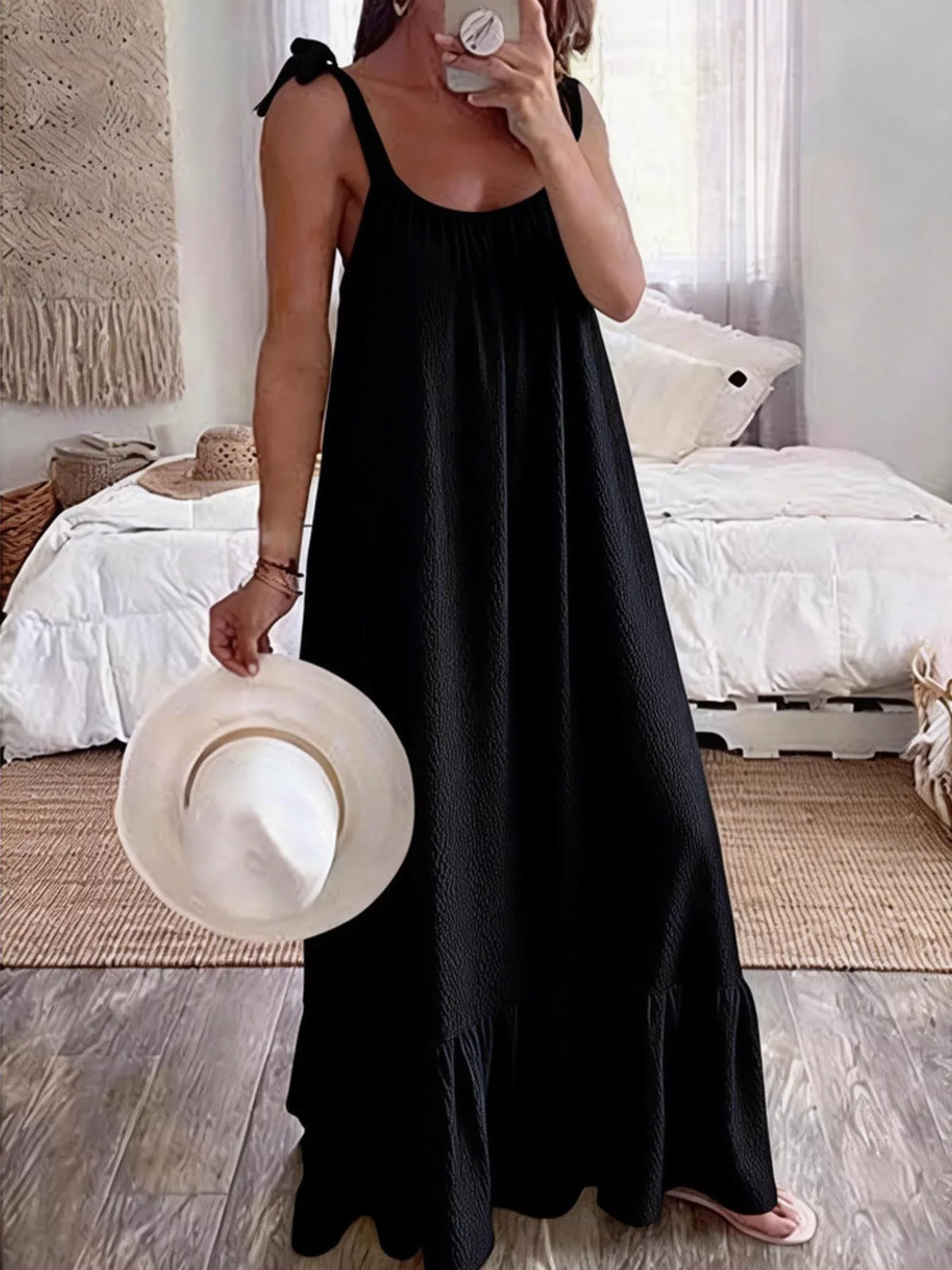 Tie-strap flowy maxi dress in black by Pinup Girl Clothing.